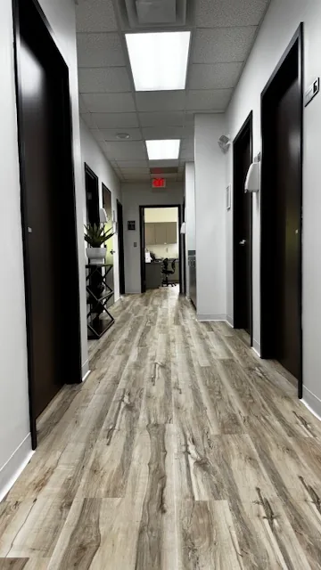 Clinic hallway leading to exam rooms